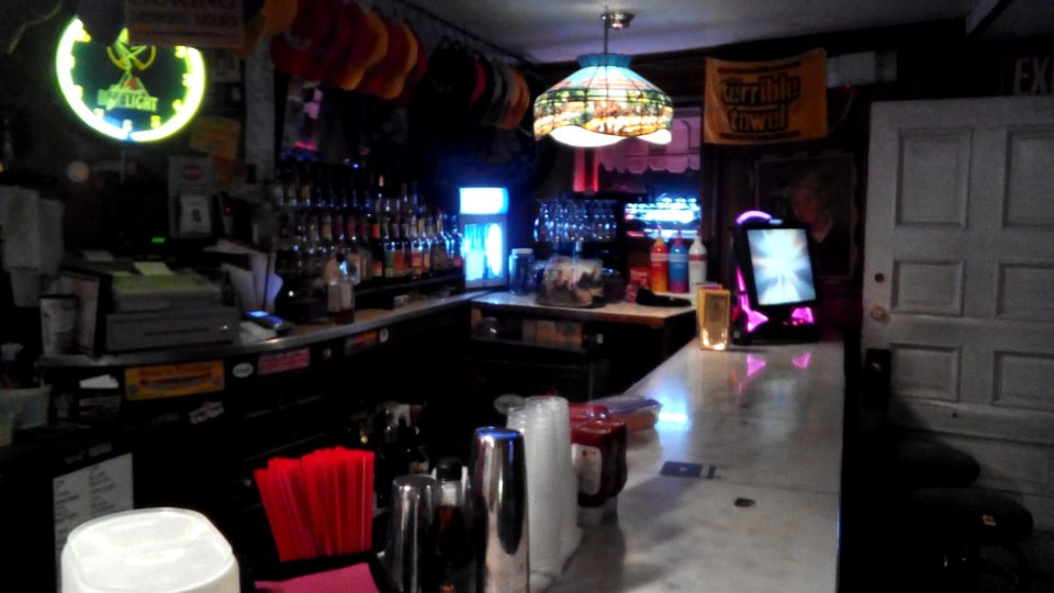 Bar seating beside a cozy restaurant interior